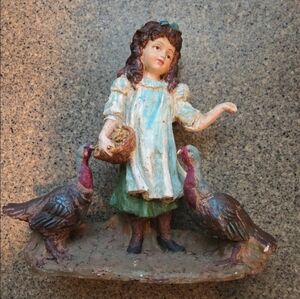 Vintage farmhouse girl feeding turkey figurine